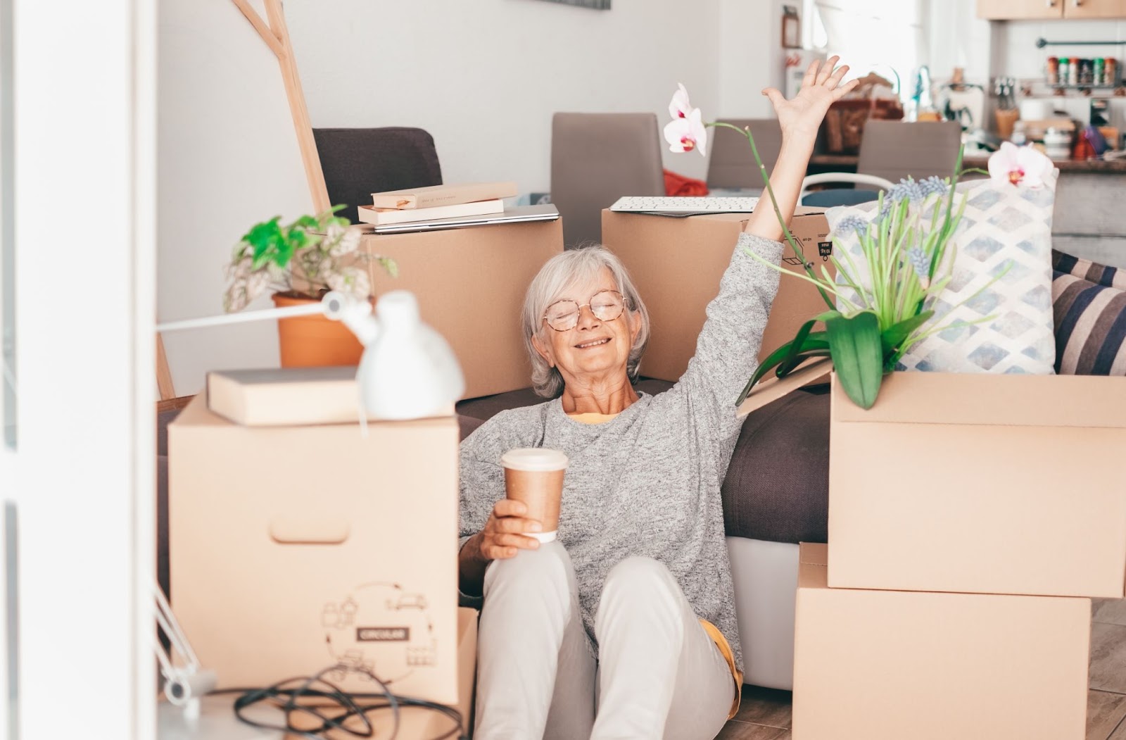 A senior celebrates moving their belongings into their new assisted living community.