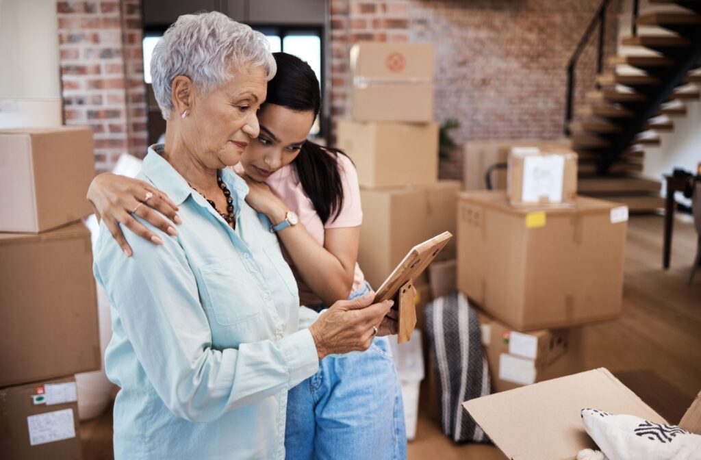 An adult helping their loved one declutter for their move to assisted living.